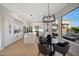 Bright kitchen boasts stainless steel appliances, eat-in area, large island, modern lighting, and backyard views at 6435 E Monte Cristo Ave, Scottsdale, AZ 85254