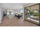 Bright, modern kitchen with white cabinets, a large island, and seamless indoor-outdoor flow to the backyard and pool area at 6435 E Monte Cristo Ave, Scottsdale, AZ 85254