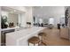 Modern kitchen with quartz countertops, stainless steel appliances, wine cooler, and an open concept living space at 6435 E Monte Cristo Ave, Scottsdale, AZ 85254
