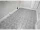 Close-up view of laundry room featuring patterned tile floors at 6435 E Monte Cristo Ave, Scottsdale, AZ 85254