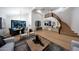 Large living room with wood floors and views into the dining area at 6435 E Monte Cristo Ave, Scottsdale, AZ 85254
