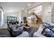 Open concept living room with high ceilings, hardwood floors, and modern furnishings at 6435 E Monte Cristo Ave, Scottsdale, AZ 85254