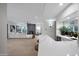 Open living space featuring a modern bar area, cozy fireplace, and comfortable seating at 6435 E Monte Cristo Ave, Scottsdale, AZ 85254