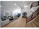 Large living room with wood floors and staircase leading to the second story at 6435 E Monte Cristo Ave, Scottsdale, AZ 85254