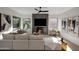 Bright and airy living room with a modern fireplace, comfortable seating, and stylish decor at 6435 E Monte Cristo Ave, Scottsdale, AZ 85254