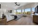Spacious main bedroom with high ceilings, many windows providing a view, and hardwood flooring at 6435 E Monte Cristo Ave, Scottsdale, AZ 85254