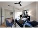 Contemporary office with a black desk, stylish decor, and light hardwood floors at 6435 E Monte Cristo Ave, Scottsdale, AZ 85254