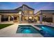 Stunning backyard pool and spa with covered patio, perfect for relaxing and entertaining outdoors at 6435 E Monte Cristo Ave, Scottsdale, AZ 85254