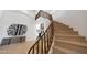 Bright foyer features a wooden staircase leading to the second floor, complemented by stylish decor and ample natural light at 6435 E Monte Cristo Ave, Scottsdale, AZ 85254