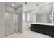 Bathroom featuring a glass enclosed shower, soaker tub, dual sink vanity and marble tile floors at 663 W Flintlock Way, Chandler, AZ 85286