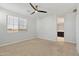 Bedroom features a neutral color scheme, plush carpeting, and a ceiling fan at 663 W Flintlock Way, Chandler, AZ 85286