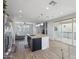 Bright, open kitchen featuring large island, stainless appliances, granite countertops, and access to the patio at 663 W Flintlock Way, Chandler, AZ 85286