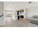 Large open kitchen with an island, granite countertops, stainless steel appliances, and access to a balcony at 663 W Flintlock Way, Chandler, AZ 85286