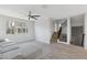 Living area featuring a view to the staircase and large bright windows at 663 W Flintlock Way, Chandler, AZ 85286
