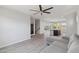 Spacious living room with stairs, wood-look flooring and sliding glass door at 663 W Flintlock Way, Chandler, AZ 85286