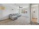 Comfortable living room with a large window and a gray sectional sofa at 663 W Flintlock Way, Chandler, AZ 85286