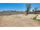 Large backyard with a privacy wall, small trees, and potential for outdoor living space at 6804 W Turquoise Ave, Peoria, AZ 85345