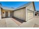 A ground-level view of the home's exterior, featuring a garage and side entry at 6804 W Turquoise Ave, Peoria, AZ 85345