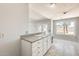 This kitchen features white cabinets and a view to the backyard at 6804 W Turquoise Ave, Peoria, AZ 85345