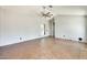 Open living room with vaulted ceiling, neutral paint and brick look flooring at 6804 W Turquoise Ave, Peoria, AZ 85345