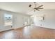 Open living room featuring large windows, neutral paint and brick-look flooring at 6804 W Turquoise Ave, Peoria, AZ 85345