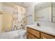 Standard bathroom with a shower-tub, a white sink, and a decorative shower curtain at 7061 E Broadway Rd # 48, Mesa, AZ 85208