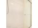 White walk-in shower with glass door and shower head at 7061 E Broadway Rd # 48, Mesa, AZ 85208