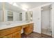 Bathroom with double sink vanity, and framed mirrors, and tile flooring in the toilet area at 7061 E Broadway Rd # 48, Mesa, AZ 85208