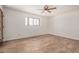 Light and airy bedroom with a ceiling fan and laminate wood flooring at 7061 E Broadway Rd # 48, Mesa, AZ 85208