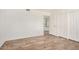 Bedroom with laminate wood flooring and a view into hallway at 7061 E Broadway Rd # 48, Mesa, AZ 85208