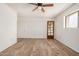 Spacious bedroom with natural light, wood-look flooring, and neutral paint at 7061 E Broadway Rd # 48, Mesa, AZ 85208