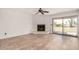 Inviting living room features a fireplace and sliding glass doors to patio at 7061 E Broadway Rd # 48, Mesa, AZ 85208