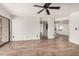 Open-concept living room with wood flooring and abundant natural light at 7061 E Broadway Rd # 48, Mesa, AZ 85208