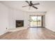 Bright living room with fireplace and sliding glass door to patio at 7061 E Broadway Rd # 48, Mesa, AZ 85208