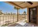 Relaxing patio with golf course views and decorative outdoor rug at 7061 E Broadway Rd # 48, Mesa, AZ 85208