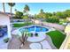Aerial view showcasing stunning pool, lush landscaping, hardscape and patio areas create outdoor resort living at 8026 W Villa Lindo Dr, Peoria, AZ 85383