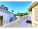 An outside balcony has tiled floors and overlooks the pool and surrounding trees at 8026 W Villa Lindo Dr, Peoria, AZ 85383
