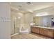 Bathroom featuring double vanities, a separate shower, and a soaking tub at 8026 W Villa Lindo Dr, Peoria, AZ 85383