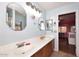 Bathroom featuring a double sink vanity with matching vanity mirrors at 8026 W Villa Lindo Dr, Peoria, AZ 85383