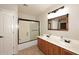 Bathroom featuring double sink vanity and enclosed shower at 8026 W Villa Lindo Dr, Peoria, AZ 85383