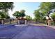 Community entrance to Silver Crest at Treasure Canyon with lush landscaping and gated entry at 8026 W Villa Lindo Dr, Peoria, AZ 85383