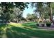 Lush green space in community with walking path and mature trees at 8026 W Villa Lindo Dr, Peoria, AZ 85383