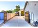 Long concrete driveway leads to garage and gated RV parking spot, creating secure parking on property at 8026 W Villa Lindo Dr, Peoria, AZ 85383