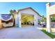Large, well lit garage offers additional storage and workspace that extends to the backyard oasis with pool at 8026 W Villa Lindo Dr, Peoria, AZ 85383