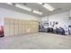 Large garage space with plenty of cabinets for storage at 8026 W Villa Lindo Dr, Peoria, AZ 85383