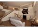 Large living room with soaring ceilings, a staircase, and a comfortable sofa at 8026 W Villa Lindo Dr, Peoria, AZ 85383