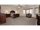 Serene main bedroom with a ceiling fan, two windows, and a sitting area at 8026 W Villa Lindo Dr, Peoria, AZ 85383