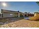 The backyard patio features custom stonework, covered seating, and drought-resistant landscaping at 1045 S Solomon St, Mesa, AZ 85204