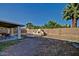 An outdoor kitchen that has stainless steel seating situated under the patio and a grassy lawn at 1045 S Solomon St, Mesa, AZ 85204