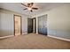 Comfortable bedroom with plush carpeting and modern ceiling fan at 1045 S Solomon St, Mesa, AZ 85204